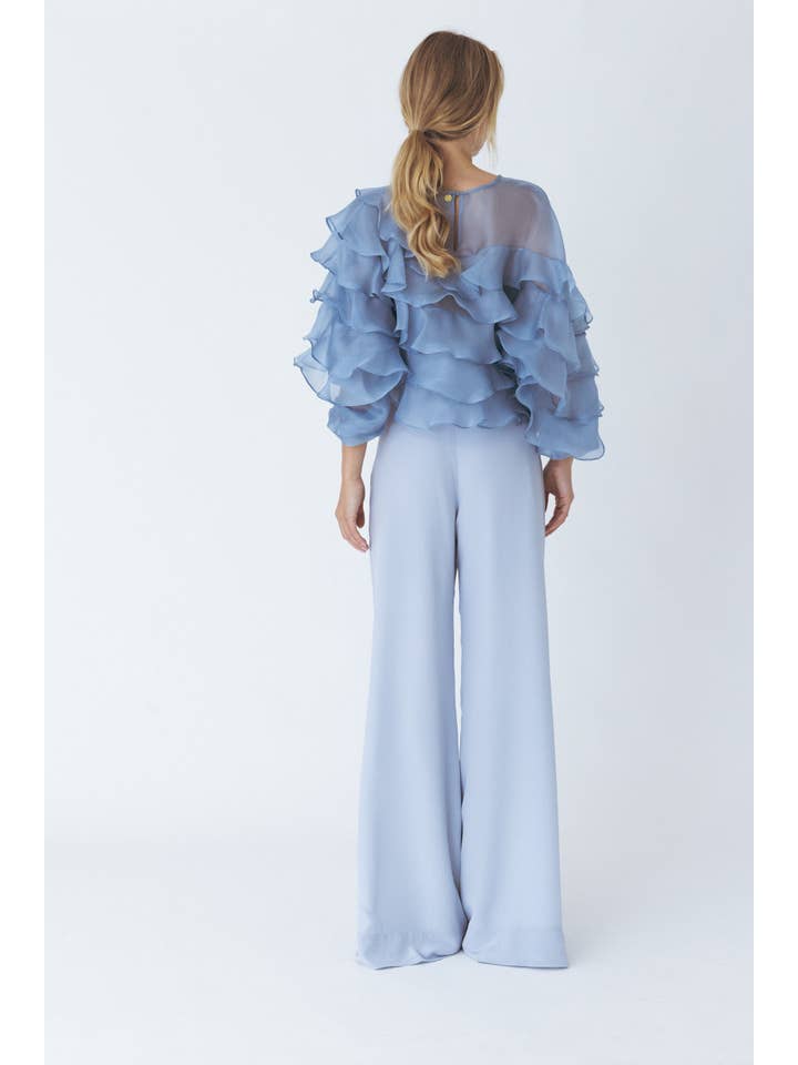 Blu Blusa blu voluminoso con volant in vendita all'ingrosso su Faire2