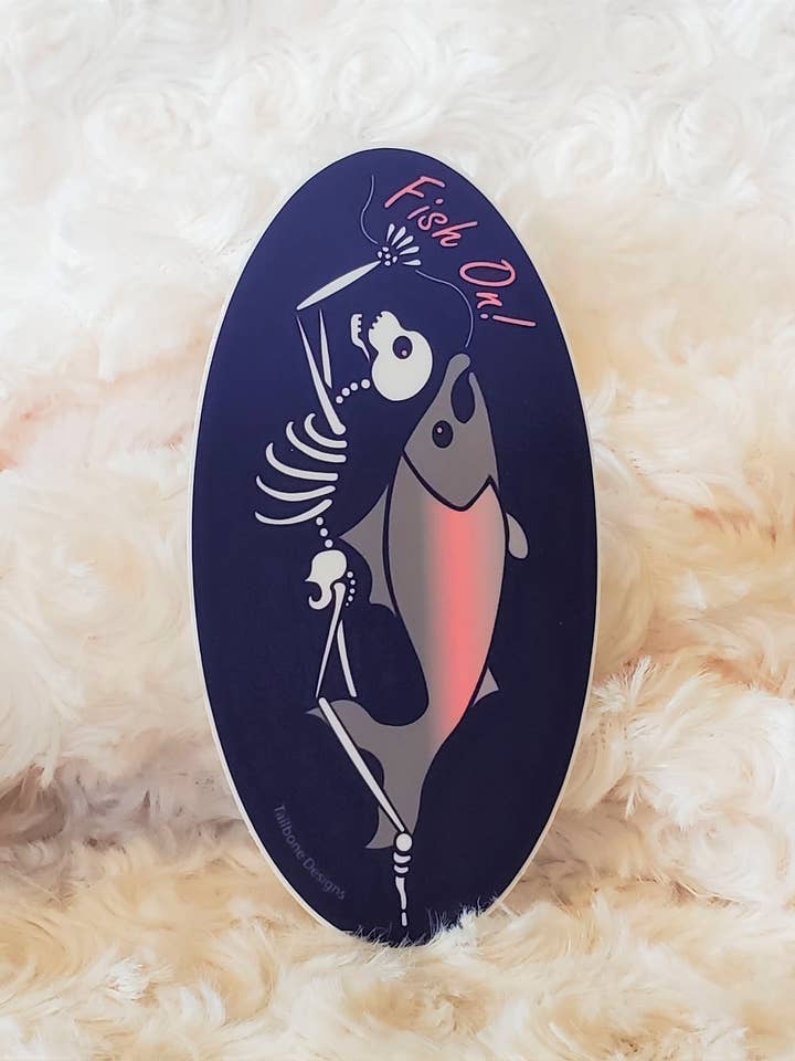 Fish On Skeleton Oval Sticker for wholesale by Tailbone Designs