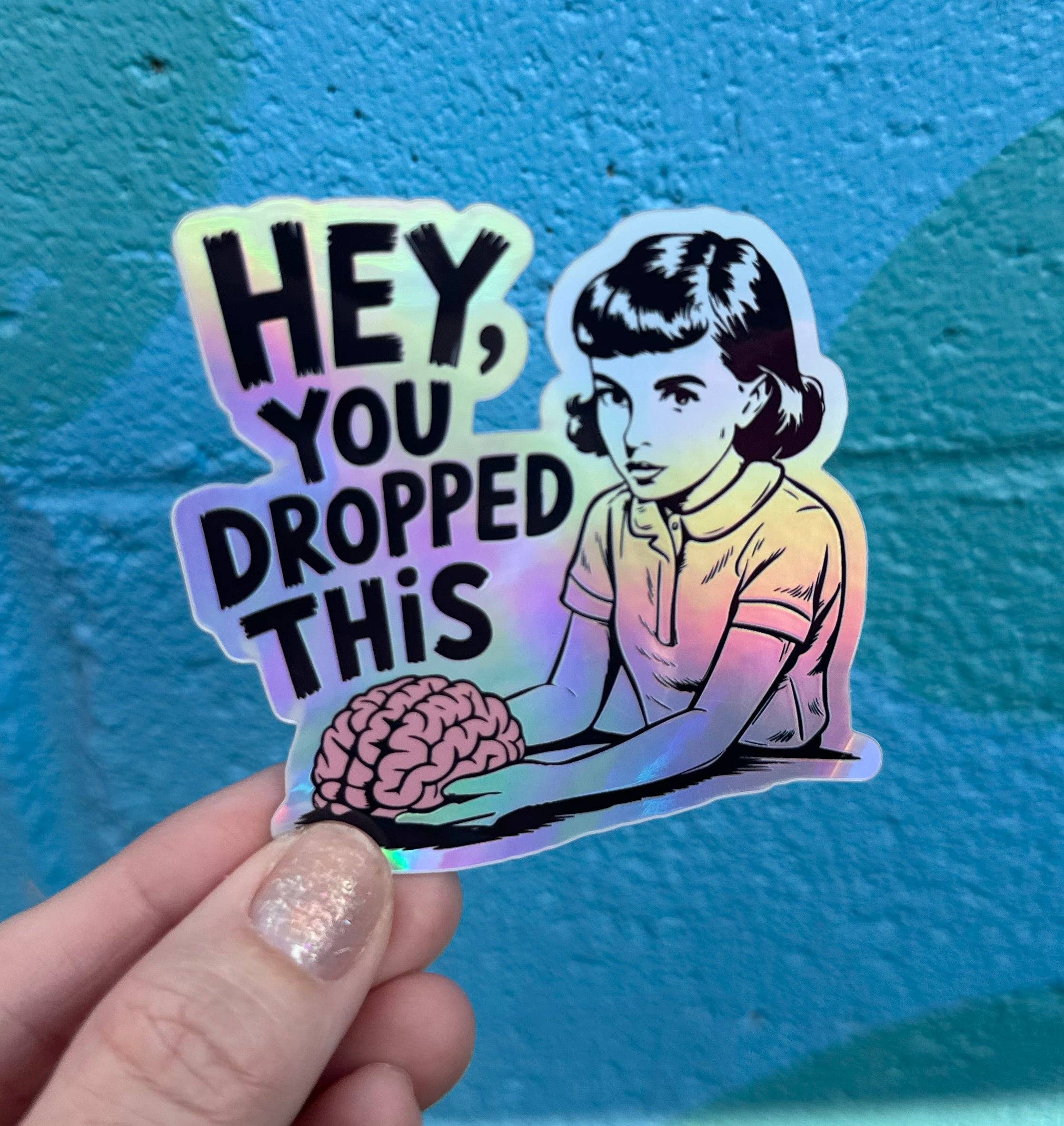Hilarious Humanitarian - Wholesale Sticker - Hey, You Dropped This Holographic Sticker2