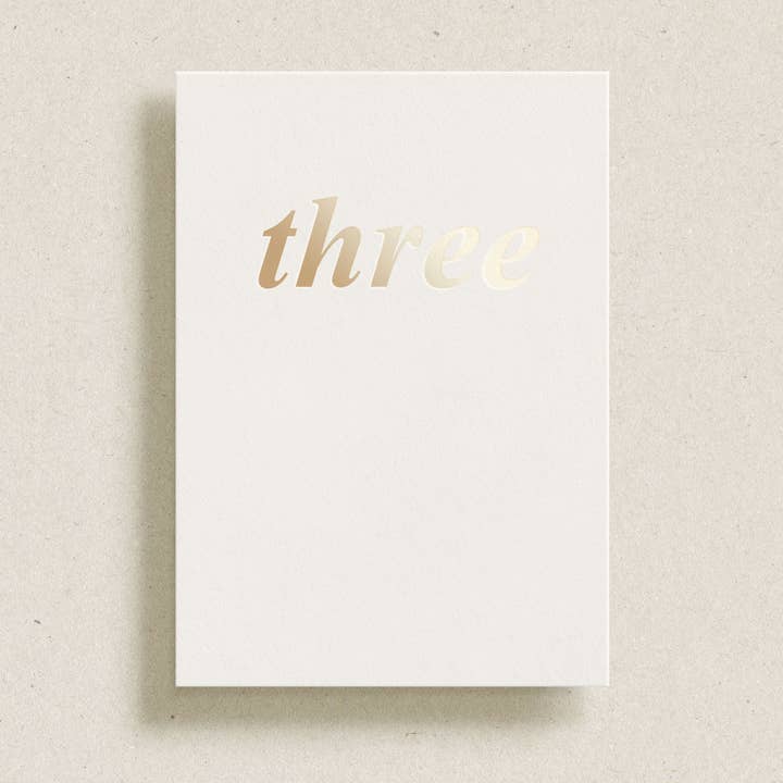 'three' gold foil greeting card for wholesale by Gardners Road