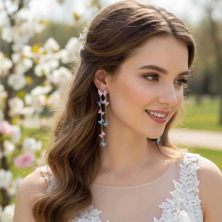 COLLEZIONE CZ - ORECCHINI PENDENTI A FARFALLA STATEMENT - CZER909 per la vendita all'ingrosso da parte di Athena Bridal Jewellery