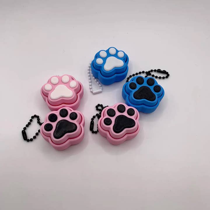 Rondom Color Dog & Cat Paw Print Fidget Clickers - 3D Printed Keychain for wholesale on Faire4