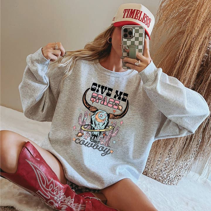 Space Cowboy Graphic Sweatshirt – Celestial Western Crewneck for wholesale by Homeward Threads