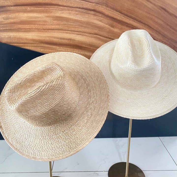 Flat brim cowboy hat in natural palm leaf straw for wholesale by Queens INC