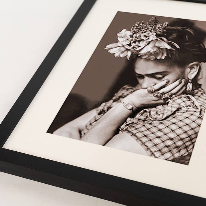 Black Frida Kahlo image. Wall art print with frame. for wholesale on Faire