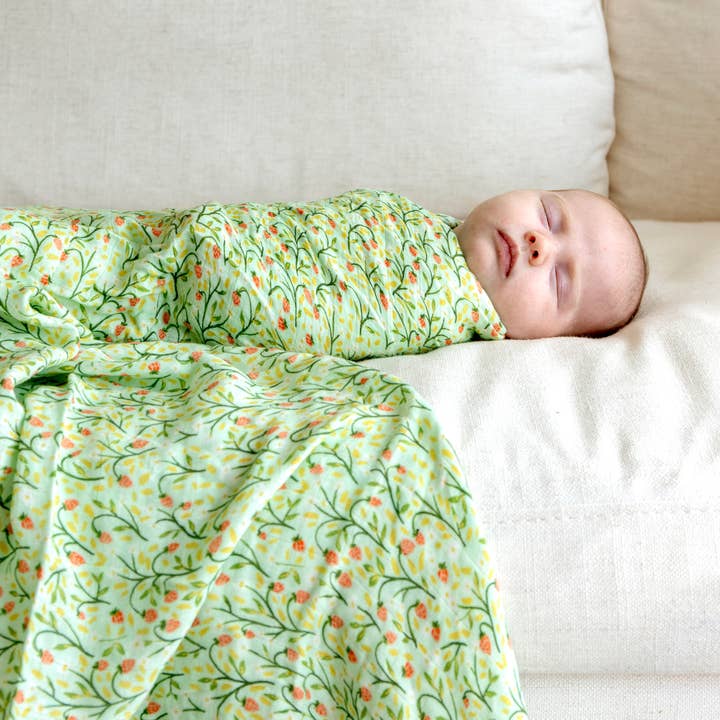 Strawberry Meadow Baby Swaddle for wholesale by 1canoe2 | One Canoe Two Paper Co.