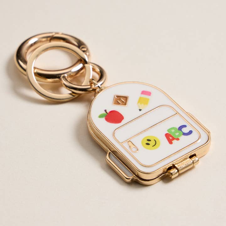 IV Gold Backpack Locket Keychain with School Supply Icons for wholesale on Faire3