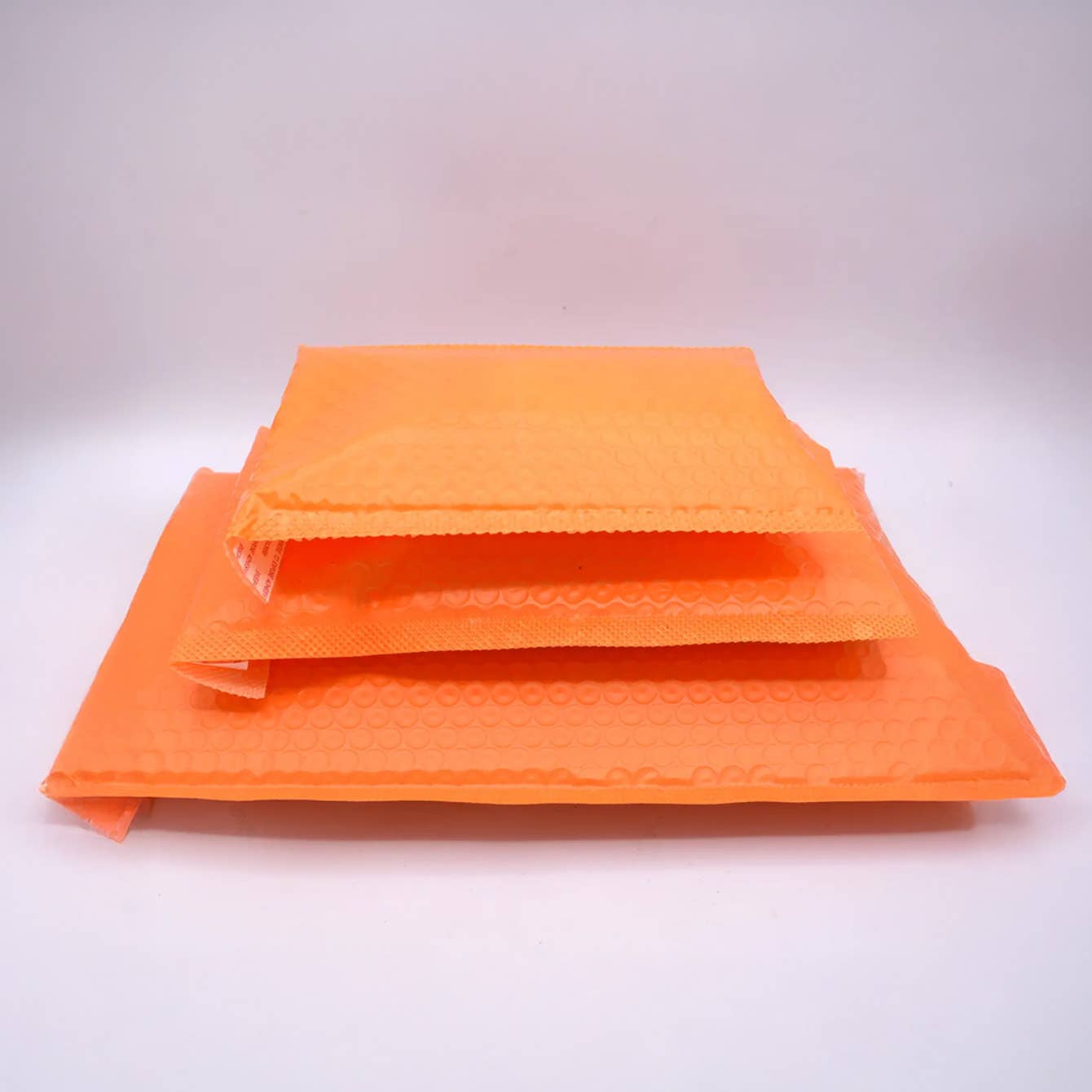 ByHome – Engroshandel Konvolutter – 50 stk., 3 størrelser orange selvklæbende polstrede boblekuverter1