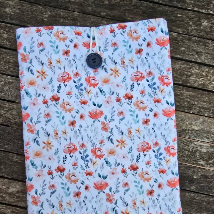 Padded book cover with orange flowers, white background for wholesale by laubelgo