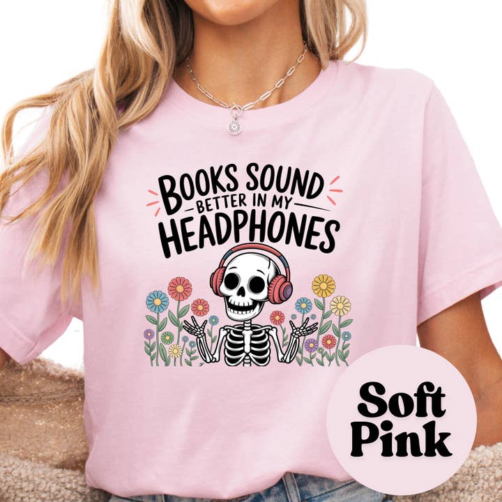 Purely Bookish - Wholesale T-Shirt (Graphic) - Women's - Books Sound Better in My Headphones Shirt – Funny Audiobook Lover Tee – Skeleton Reading Shirt – Spooky Bookish Graphic Tee – Book Nerd Gift