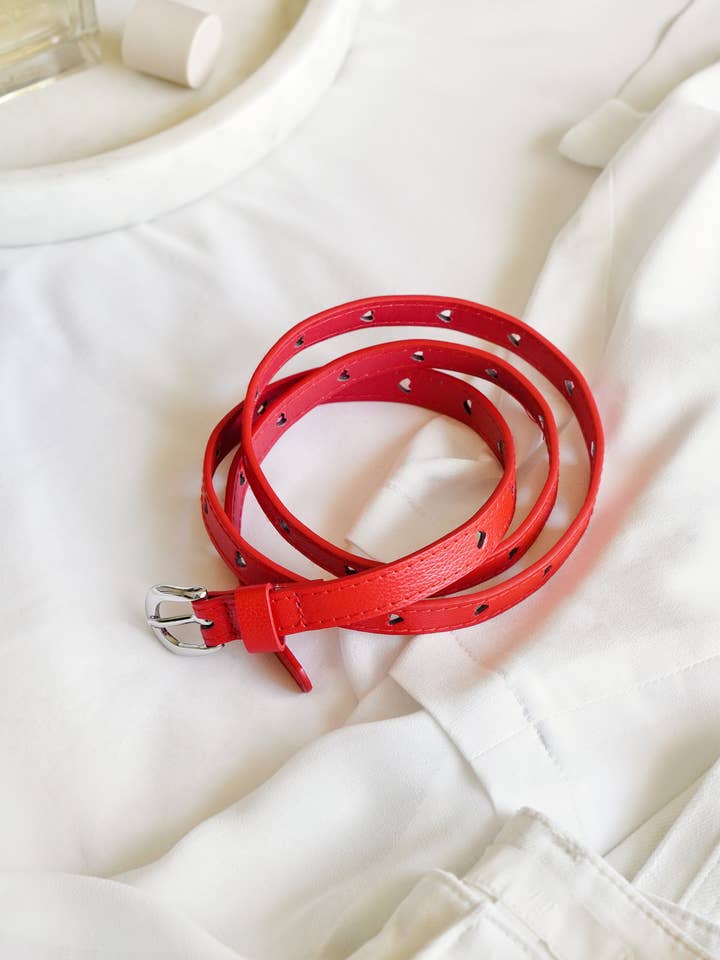 Red PU Skinny Belt with Heart Holes for wholesale by Xander Kostroma