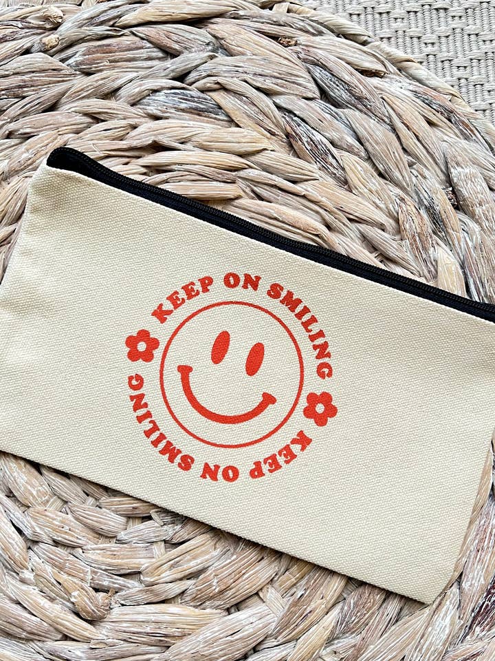 Keep On Smiling Zip Up Pouch for wholesale by taelormade