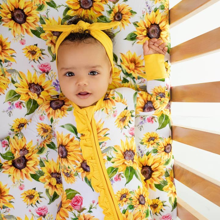 Suns and Roses (Sunflowers) Ruffle Romper, bamboo baby romper, bamboo pajama romper, soft baby romper, eco friendly baby romper, unisex baby outfit, baby sleepwear, sustainable baby clothes, bamboo sleep romper, cozy baby pajamas, bamboo sleepwear for wholesale by Jammie Session formerly Big Dreams Little Jammies
