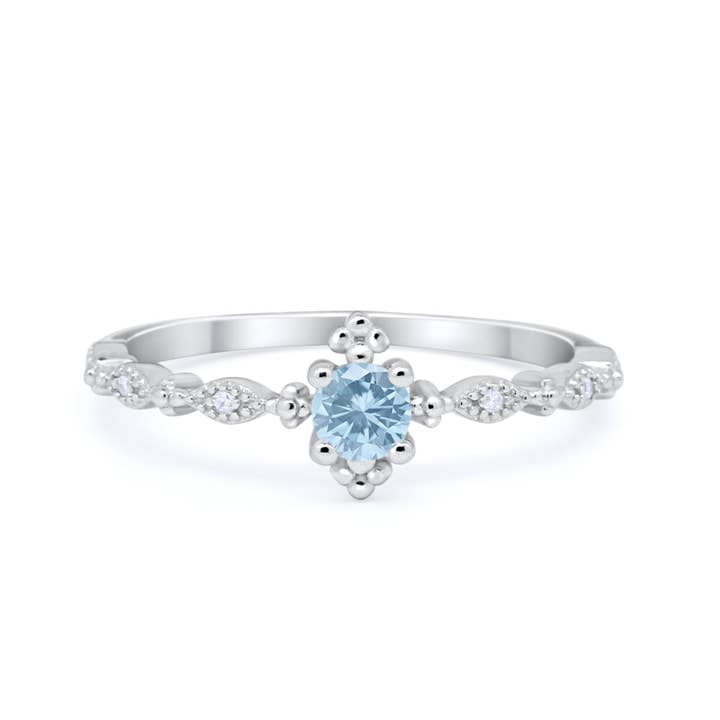 Petite Dainty rund simuleret akvamarin CZ-ring for engroshandel hos Blue Apple Imports