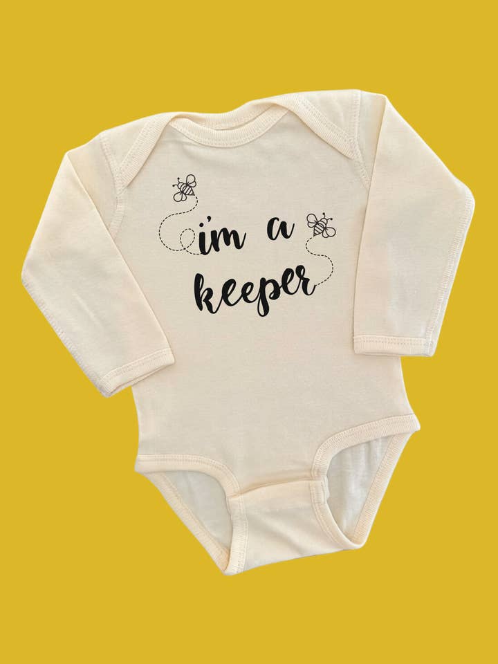 CREAM I'm a Keeper (Bee Keeper) Long Sleeve Baby Onesie Bodysuit for wholesale on Faire1