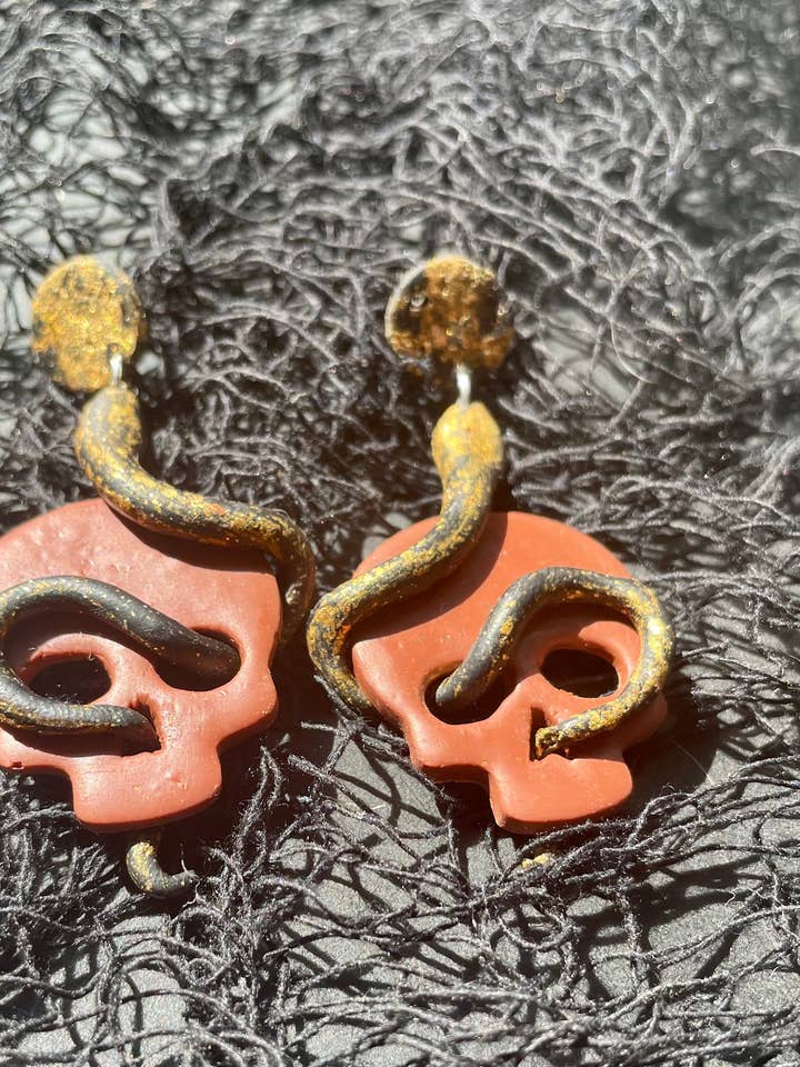 Pendientes colgantes ojo de calavera de serpiente para venta al por mayor de She makes clay