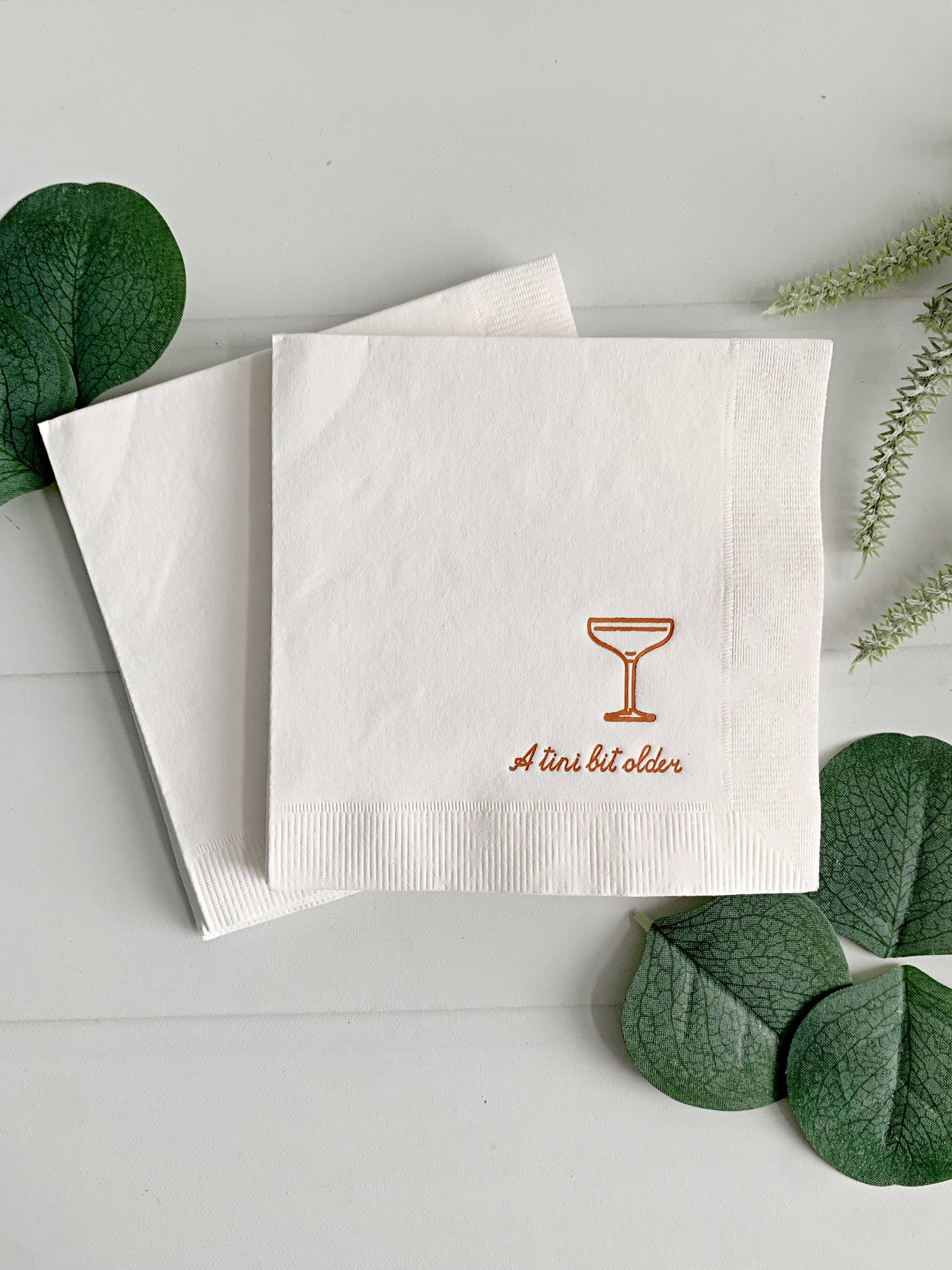 EnFete, LLC - Wholesale Disposable Napkin - Tini Bit Older Cocktail Napkins - Copper on White