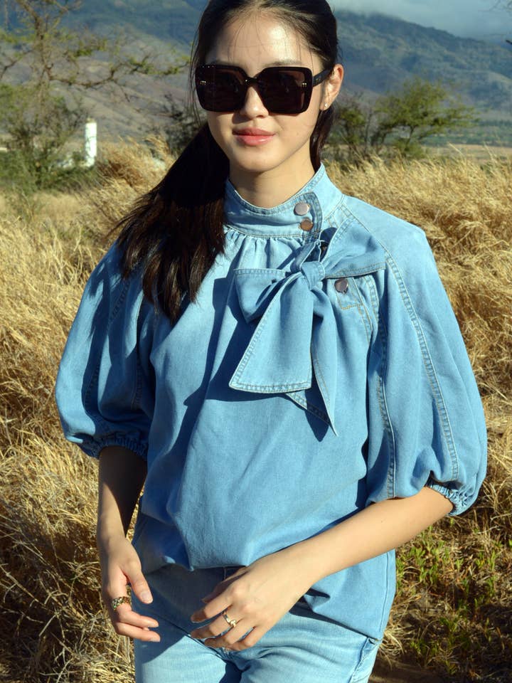 T2308XXNZ19780- Top de mezclilla tejida con cuello alto y manga abullonada para venta al por mayor de ESLEY