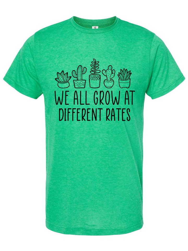 Camiseta Todos nós crescemos em taxas diferentes por atacado de The Whimsy Shoppe