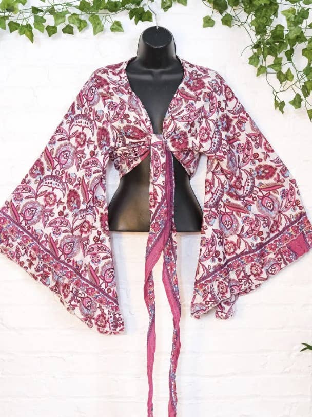 Bohemian Floral Wrap Top and other Purchase Wholesale boho tops. Free Returns & Net 60 Terms on Faire trending on Faire.