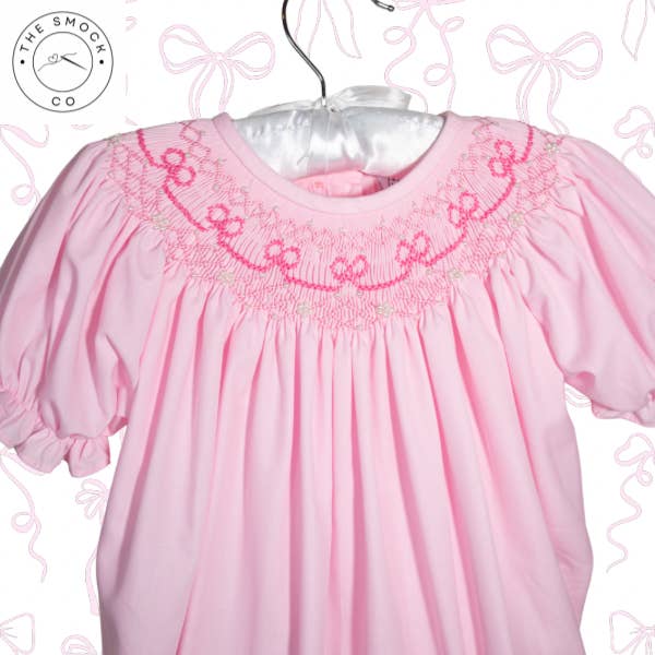 Pink Bow Pearl Hand smocked Dress for wholesale by The Smock Co