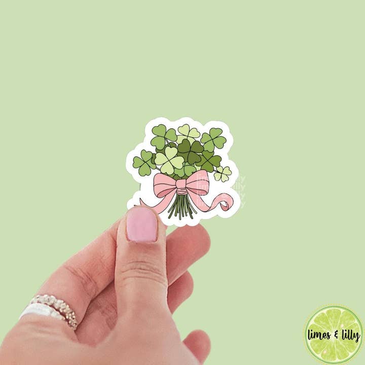 Lucky Green 4 Leaf Clover Shamrock Flower Bouquet Coquette Bow Vinyl Sticker | St. Patrick’s Day Sticker | Irish Sticker | Kindle Stickers | for wholesale by Limes & Lilly
