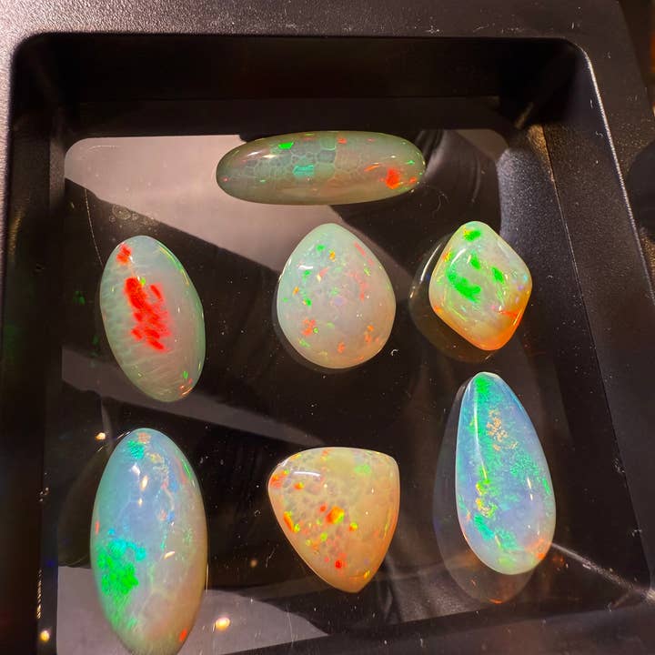 Welo Opal Cabochons – 7 pcs Jewelry-Grade Parcel (36.30 CT) for wholesale by Modeeq Gems