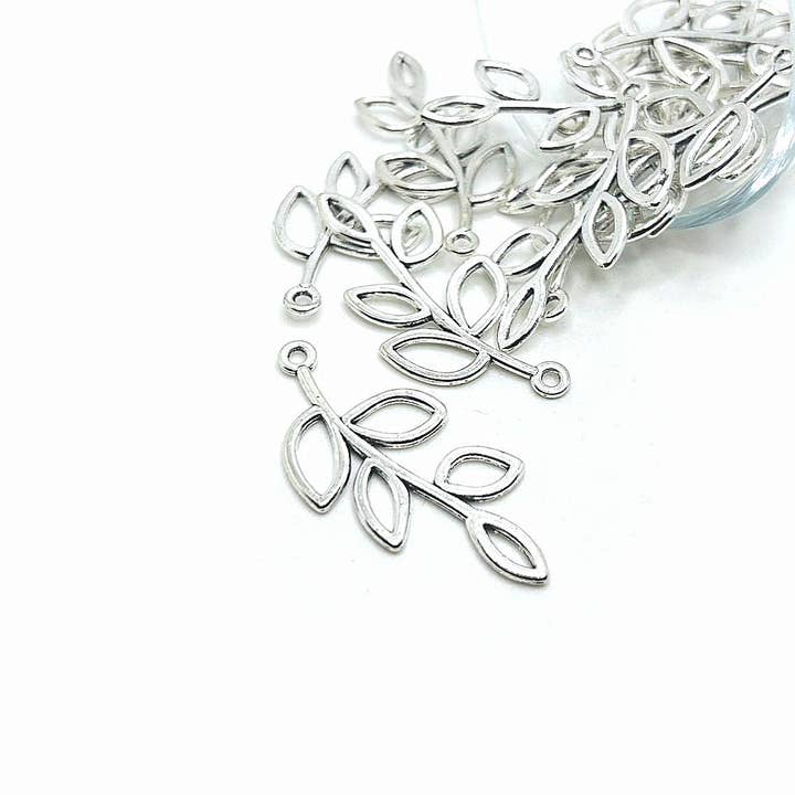 Antiqued Silver Tree Branch Charm, Leaf Connector, 42x19mm for wholesale by Guerrilla Charm