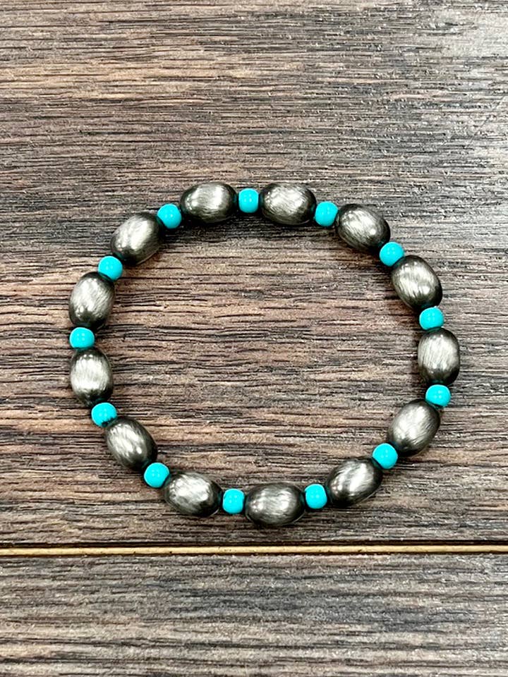 711600, Handmade 10mm Oval Navajo Bead Stretch Bracelet for wholesale by ISAC Trading Inc