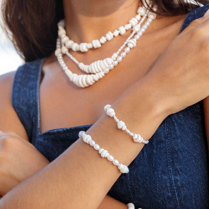 Silver Puka Shell Pearl Bracelet - Maka and other Purchase Wholesale puka shells. Free Returns & Net 60 Terms on Faire trending on Faire.