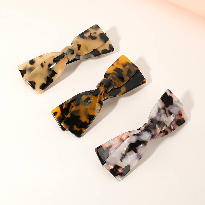 Barrette nœud en acétate de celluloïd pour la vente par Sensibling Corp.