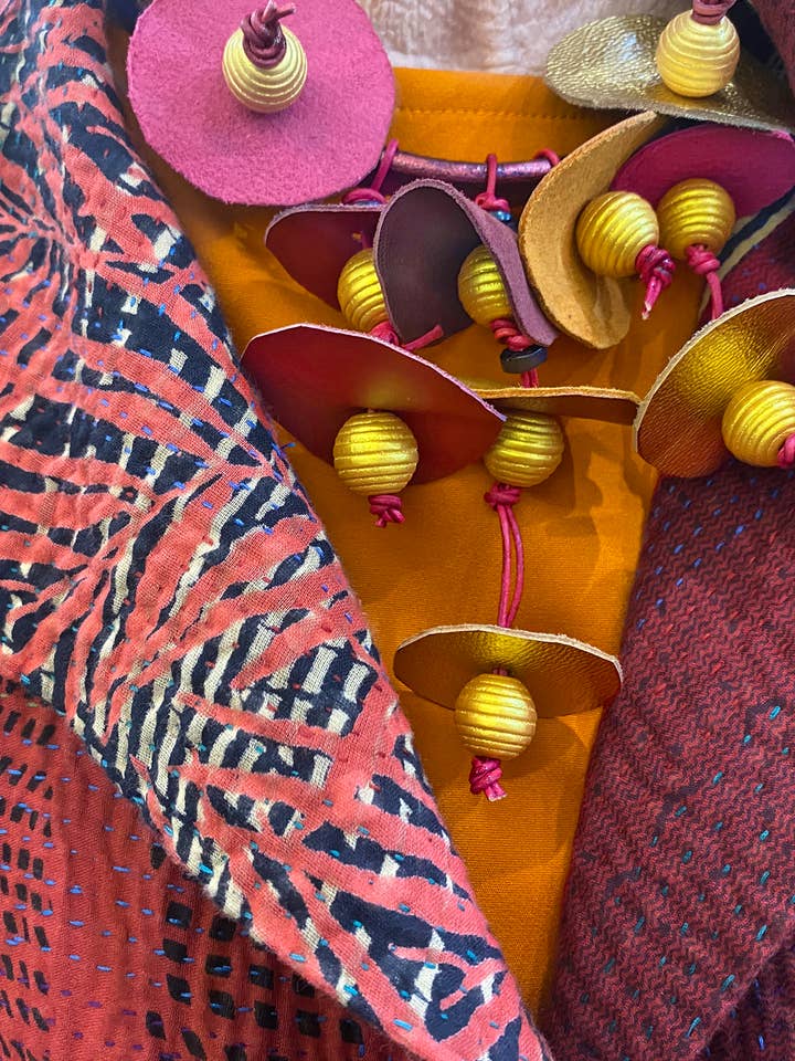 Golden Fuchsia Bib Necklace for wholesale by Phyllis Clark