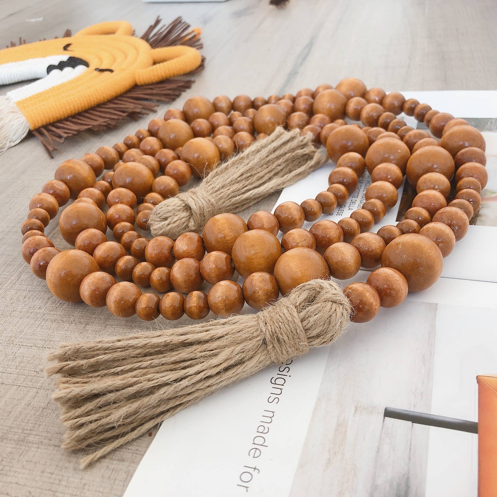 Brown Home Decoration Hemp Rope Tassel Wood Bead String Ornaments for wholesale on Faire1