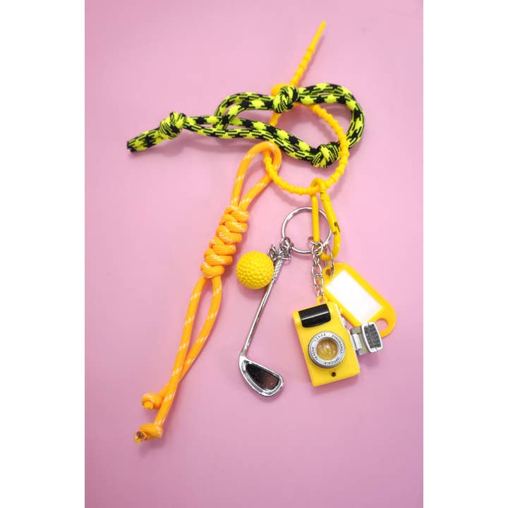 Gold ROPE CORD CAMERA GOLF BAG CHARM KEYCHAIN | 40KC145 for wholesale on Faire