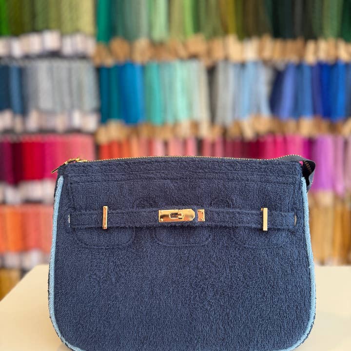 The Designer Signature Mini Clutch - Fall Regatta and other Purchase Wholesale regatta. Free Returns & Net 60 Terms on Faire trending on Faire.