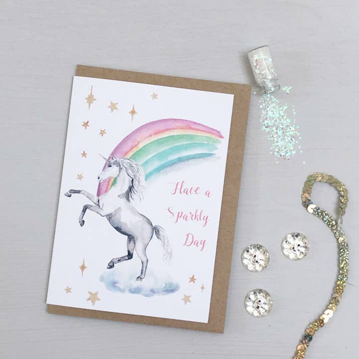 Unicorn rainbow hand painted greetings card for wholesale by Katie Hipwell Design
