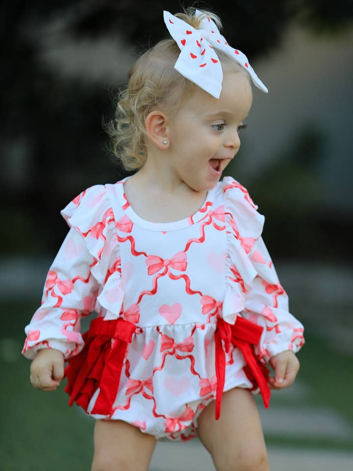 Girls Valentine Romper with Heart Print and Bowknot Design for wholesale by Rylee Faith Designs