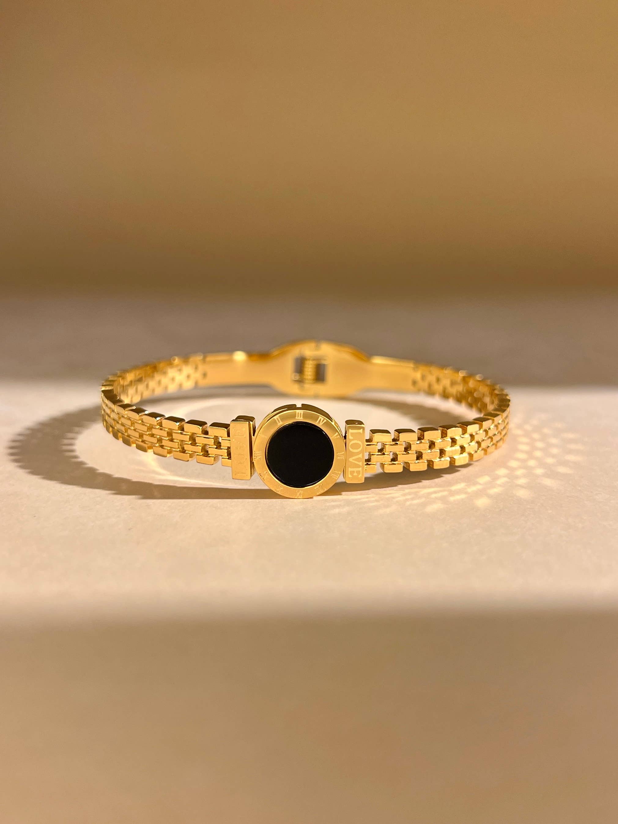 COSMOS – wholesale Cuff bracelet – Gold stainless steel bangle bracelet with round black medallion1