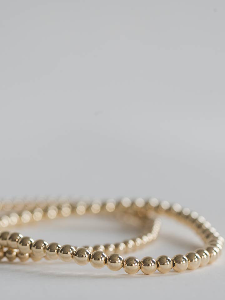 4mm 14k gold filled smooth round beaded bracelet for wholesale by Bizzy Beads