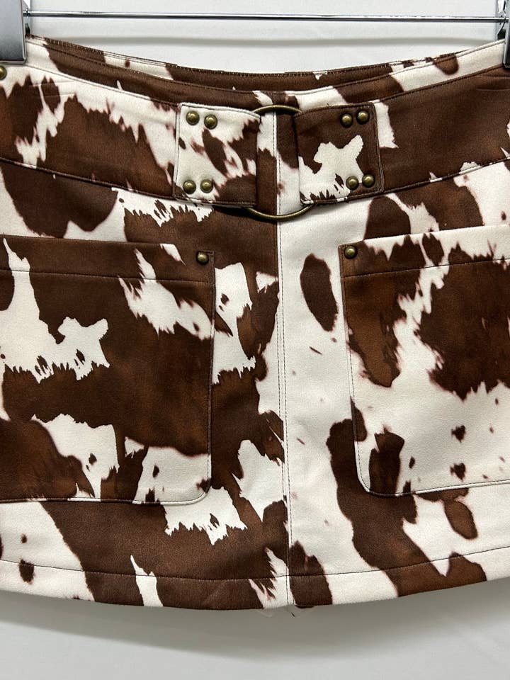 SIP6440B COW PRINT SKORT W/STUDDED DETAIL for wholesale by Saints & Hearts