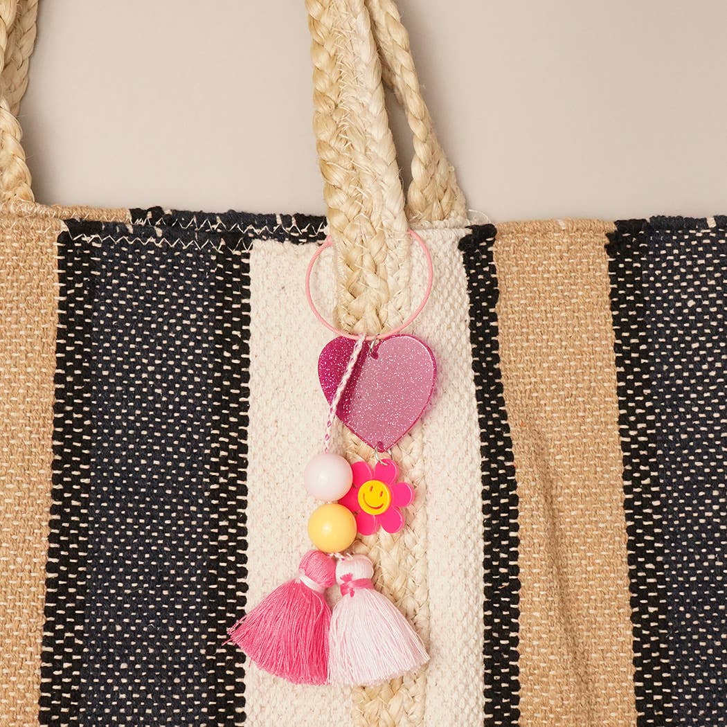 Fashion City - Wholesale Sleutelhanger - Dames - Happy Face sleutelhanger met glitterhart en kwastje, bedeltje1