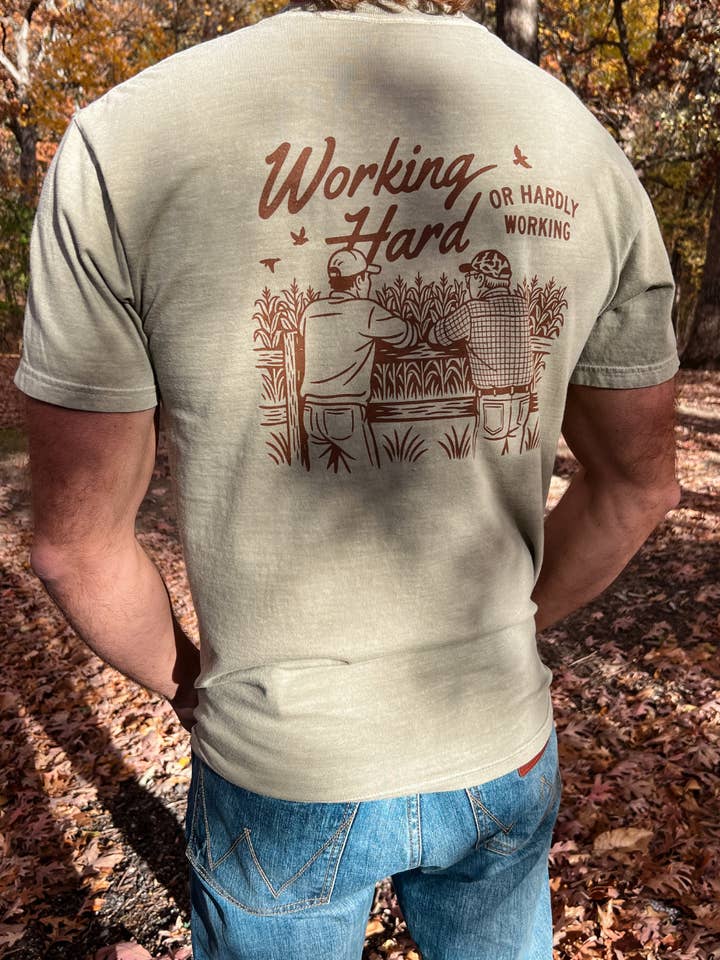 Working Hard or Hardly Working Graphic Tee in Khaki for wholesale by Kelso & Company