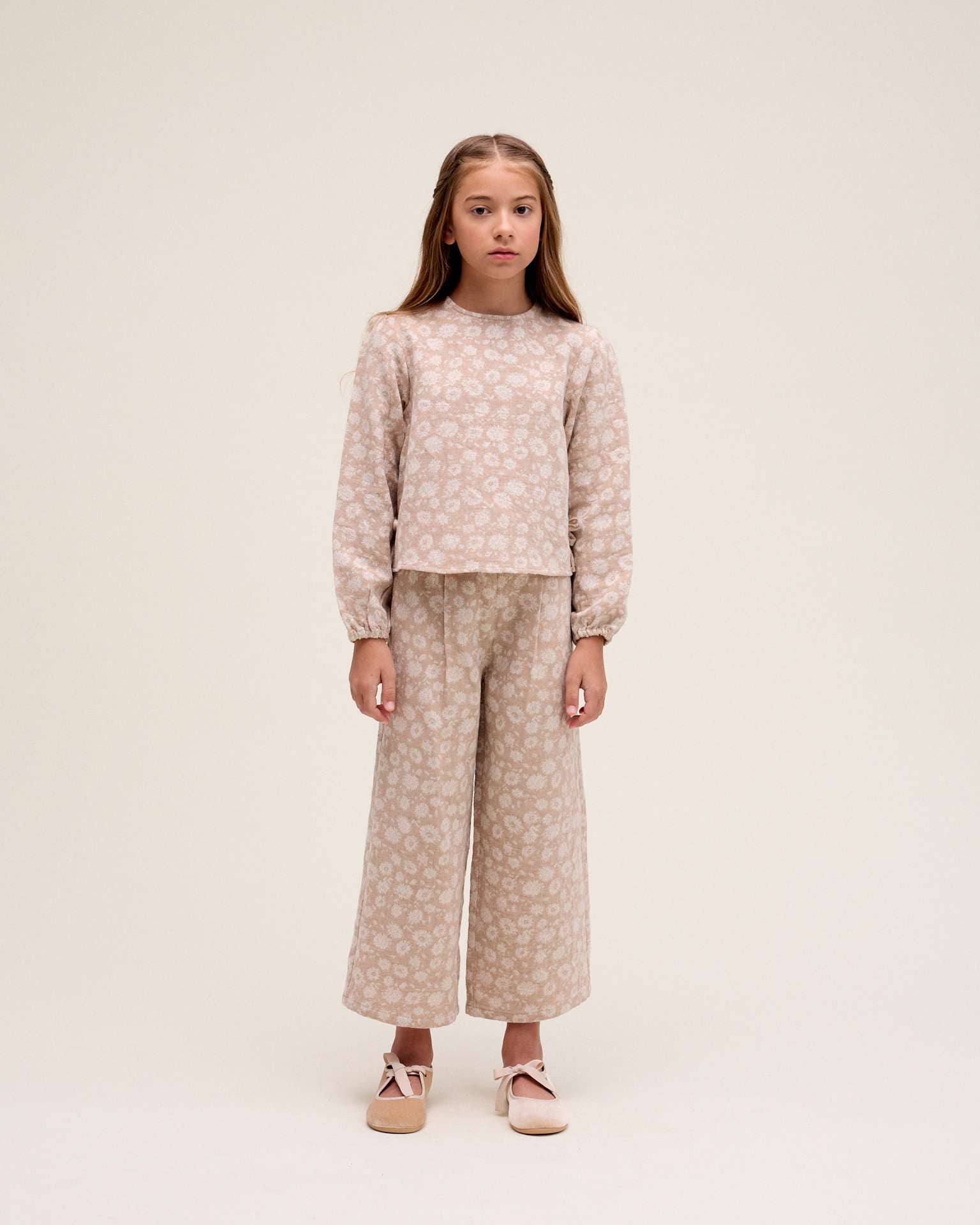 Natural Girl's long culotte pants in beige with floral print for wholesale on Faire