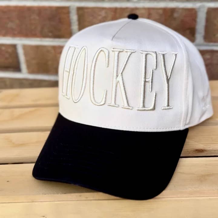 Monochromatic Hockey Trucker Hat | Embroidered Hockey Sticks Side Detail | Neutral Game Day Hat | Adjustable Snapback for wholesale by Swain Co. Embroidery & Press