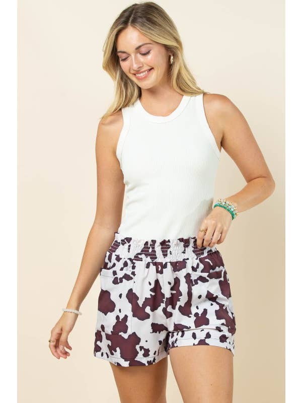 Brown Cream AP1312-MARGOT COW PRINT SMOCK ELASTIC WAIST WOVEN SHORTS for wholesale on Faire1