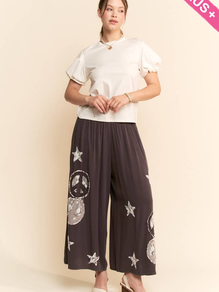 Charcoal PEACE AND STAR PATCHWORK LEG PANTS for wholesale on Faire4