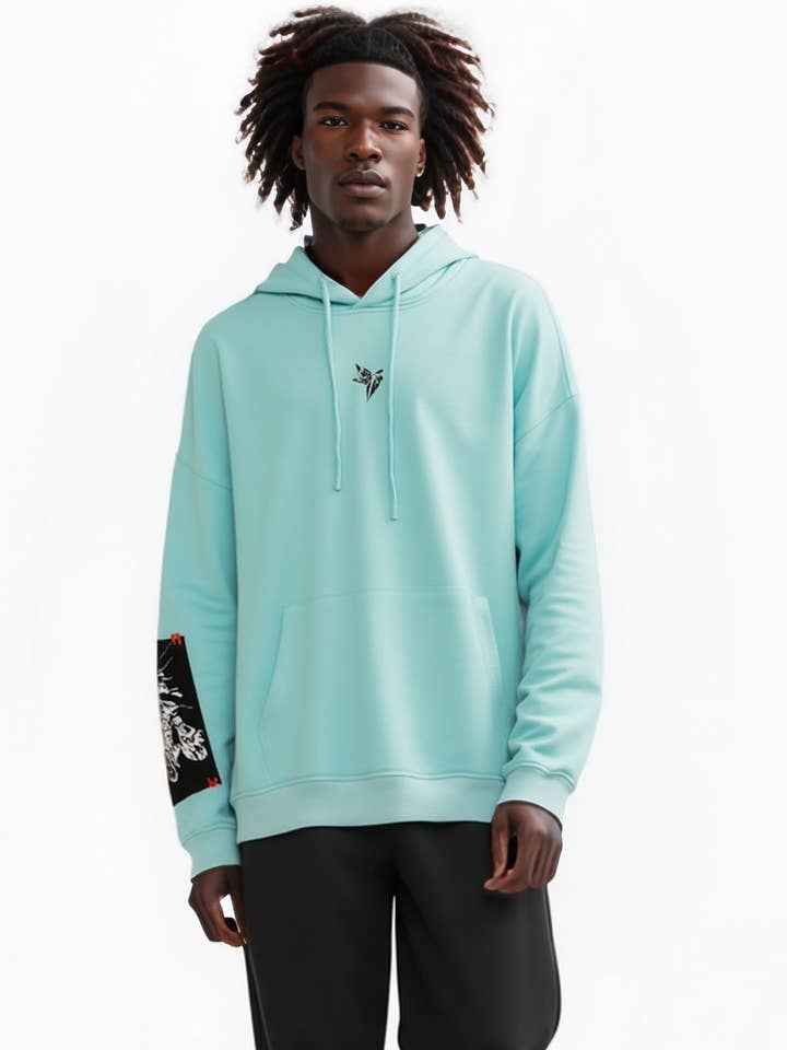 Konus Men's Logo Print Patch Hoodie in Teal for wholesale on Faire