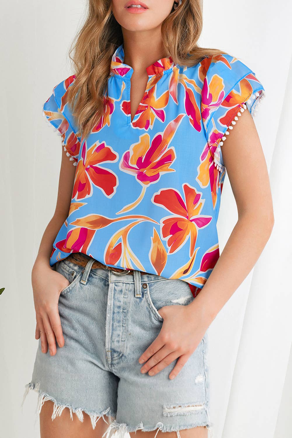 As shown Floral Print V Neck Pompom Trim Flutter Sleeve Blouse | S-XL for wholesale on Faire2