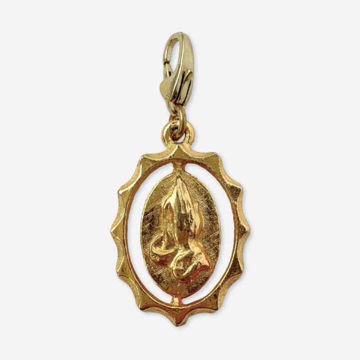 Vintage gold tone praying hands oval charm for wholesale by Lulu’s Petals