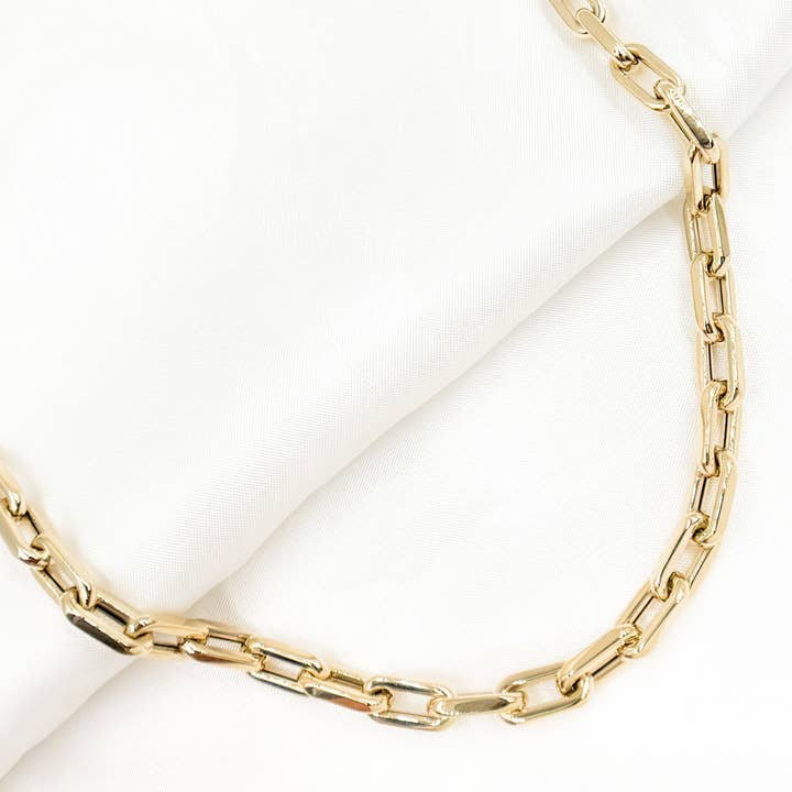 568/A074/G. 14K Yellow Gold Hollow Smooth and Flat Paperclip Chain for wholesale by Jewels & Chains